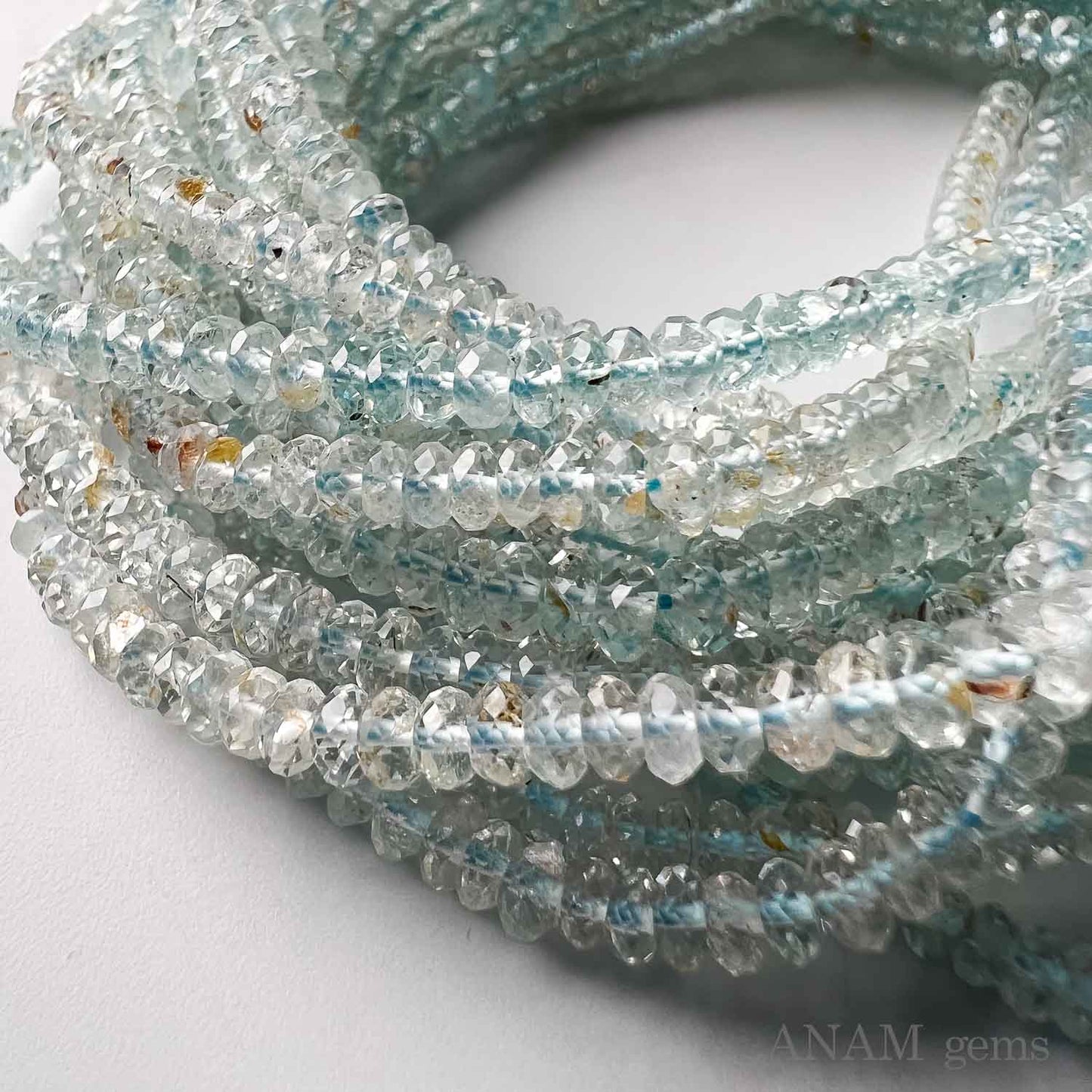 Aquamarine button cut (Rondel) clear