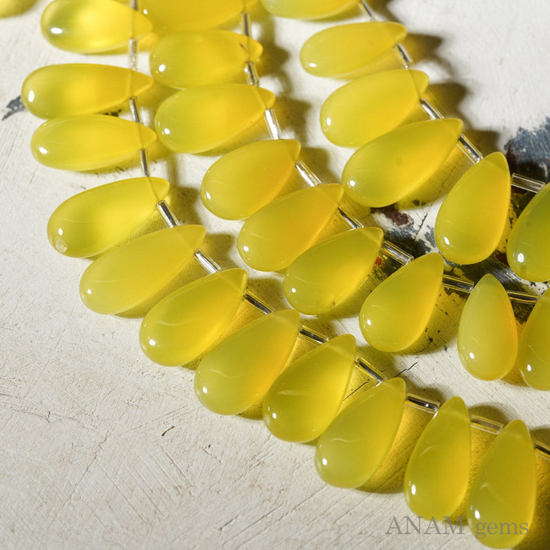 カナリーイエローカルセドニー スムース ロングペアシェイプ